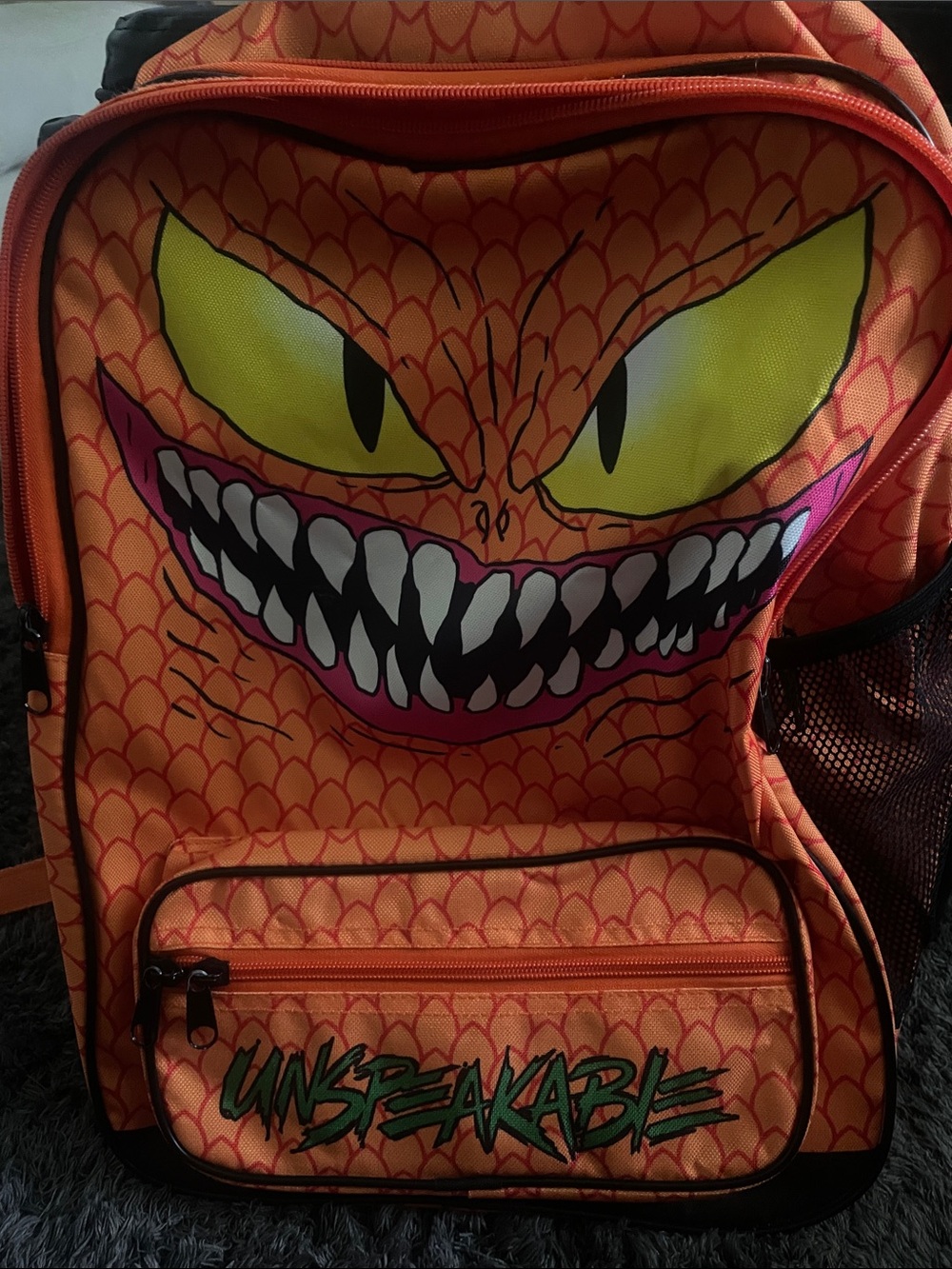Orange 'Unspeakable' Monster Face Backpack